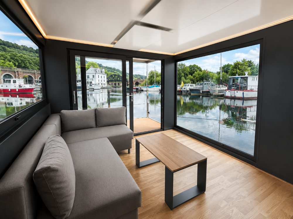 The lounge inside a houseboat at The Customs House, Bowling, with the canal on three sides